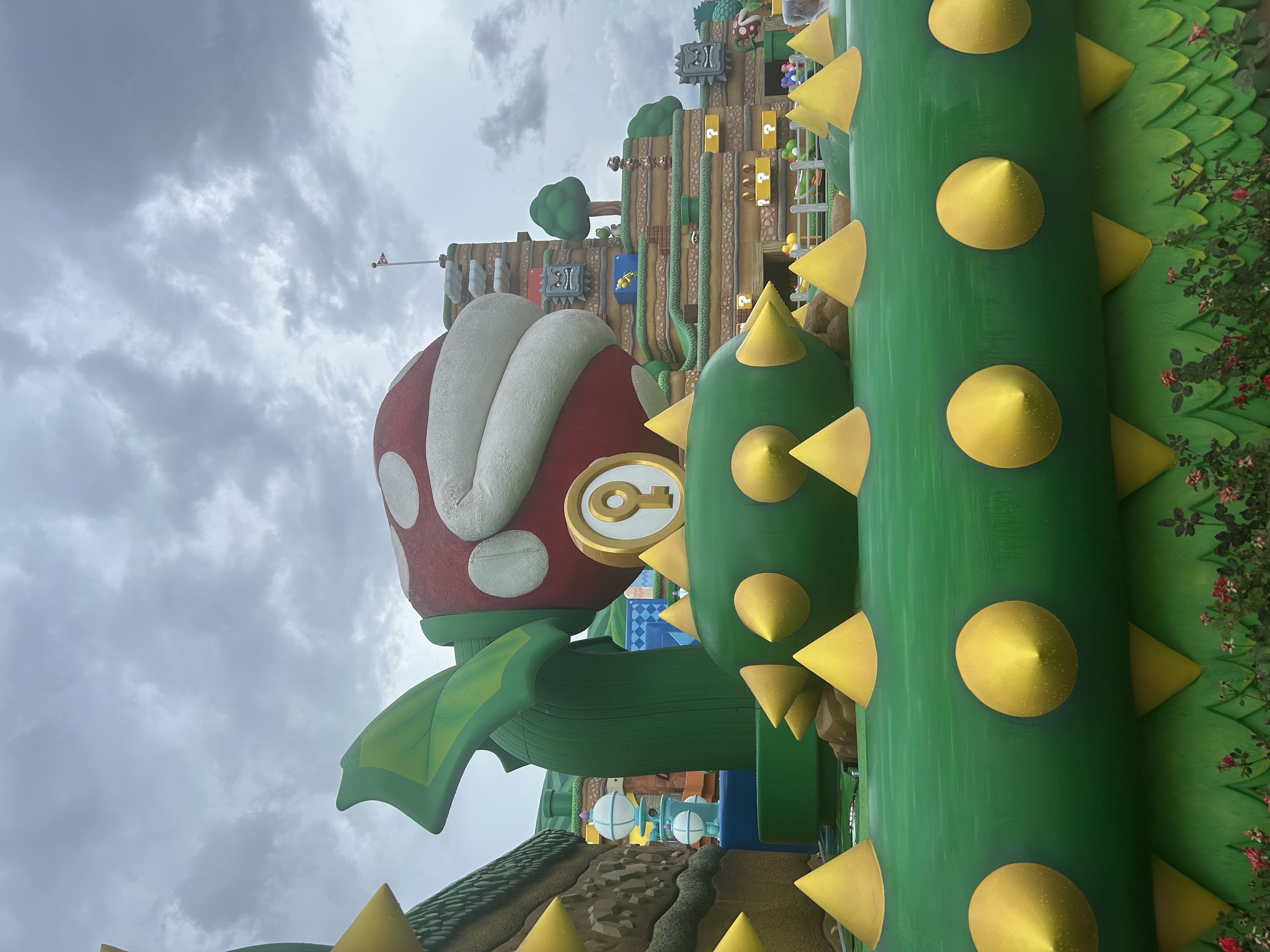 Super Nintendo World at Universal Studios Osaka — giant Piranha Plant with gold key medallion