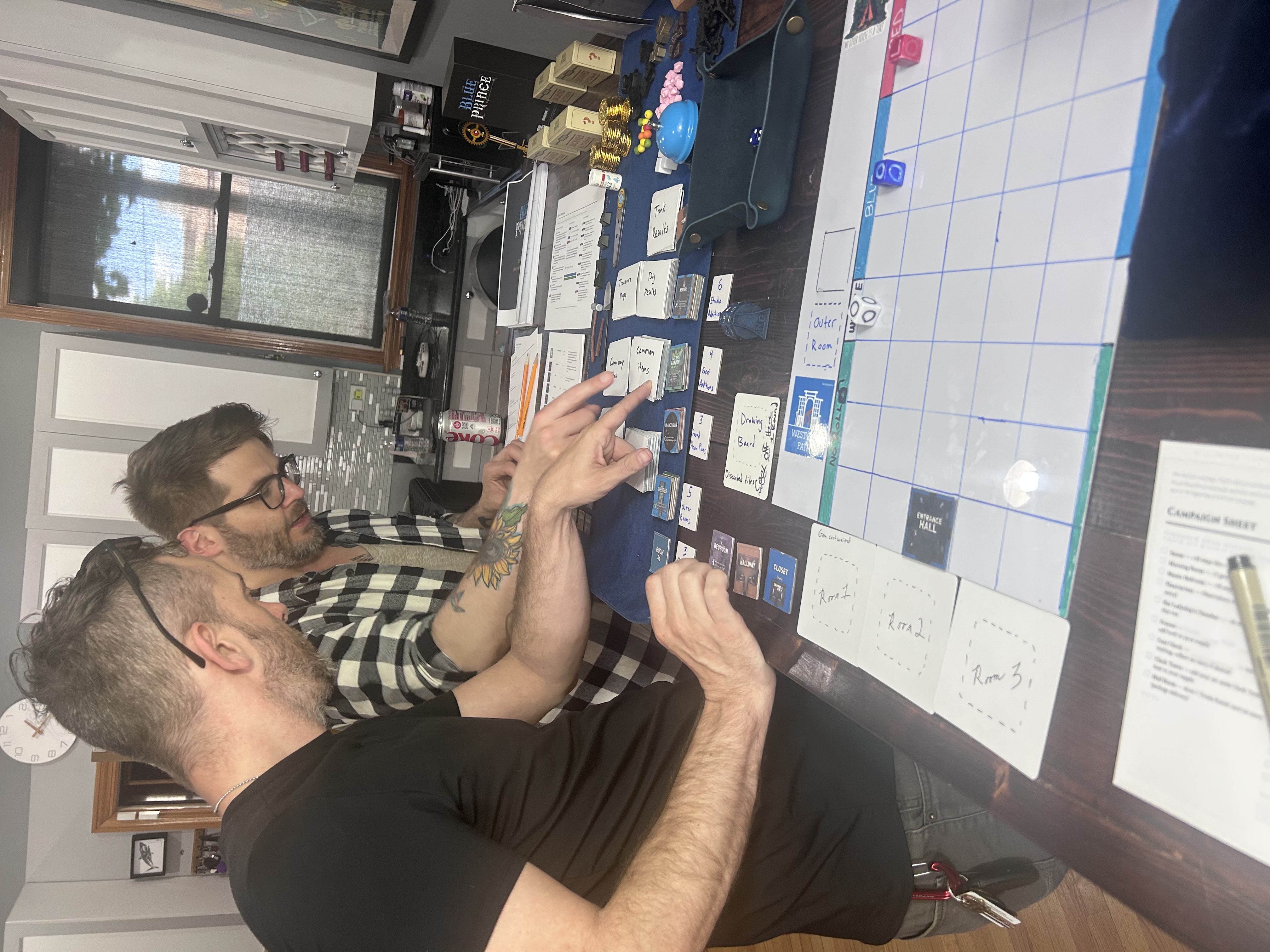 Mike and Chris playing Blue Prince co-op at the table