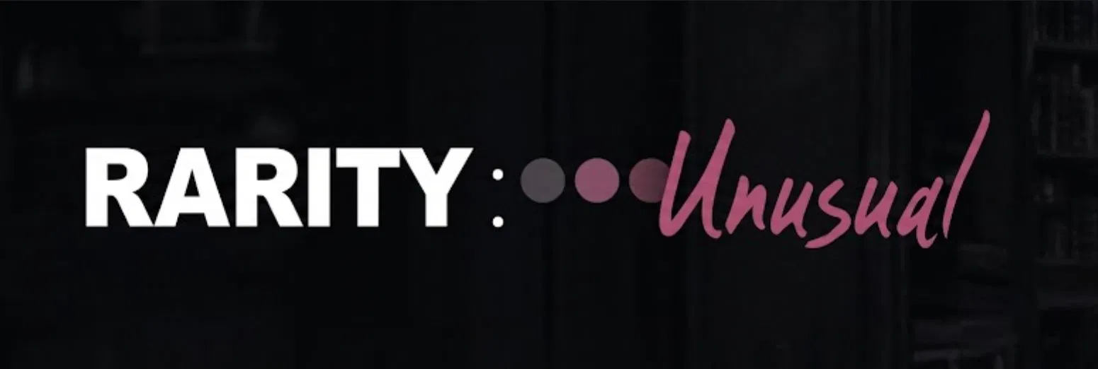 Title treatment reading RARITY, three pink dots, and the word Unusual in script on a dark blurred background