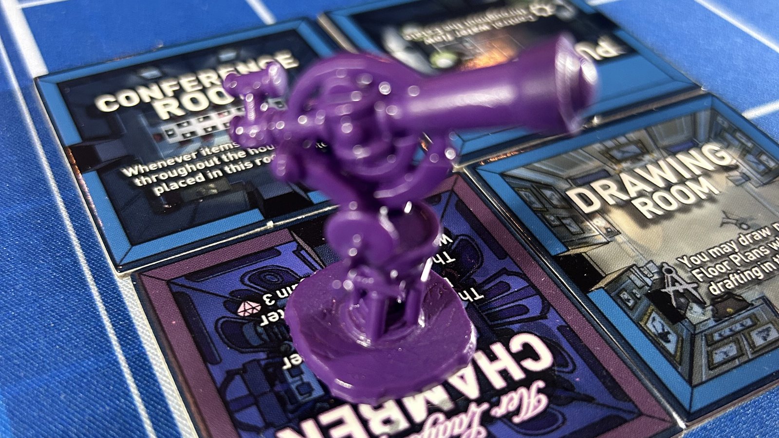 A purple painted telescope miniature standing on Her Ladyship's Chamber tile