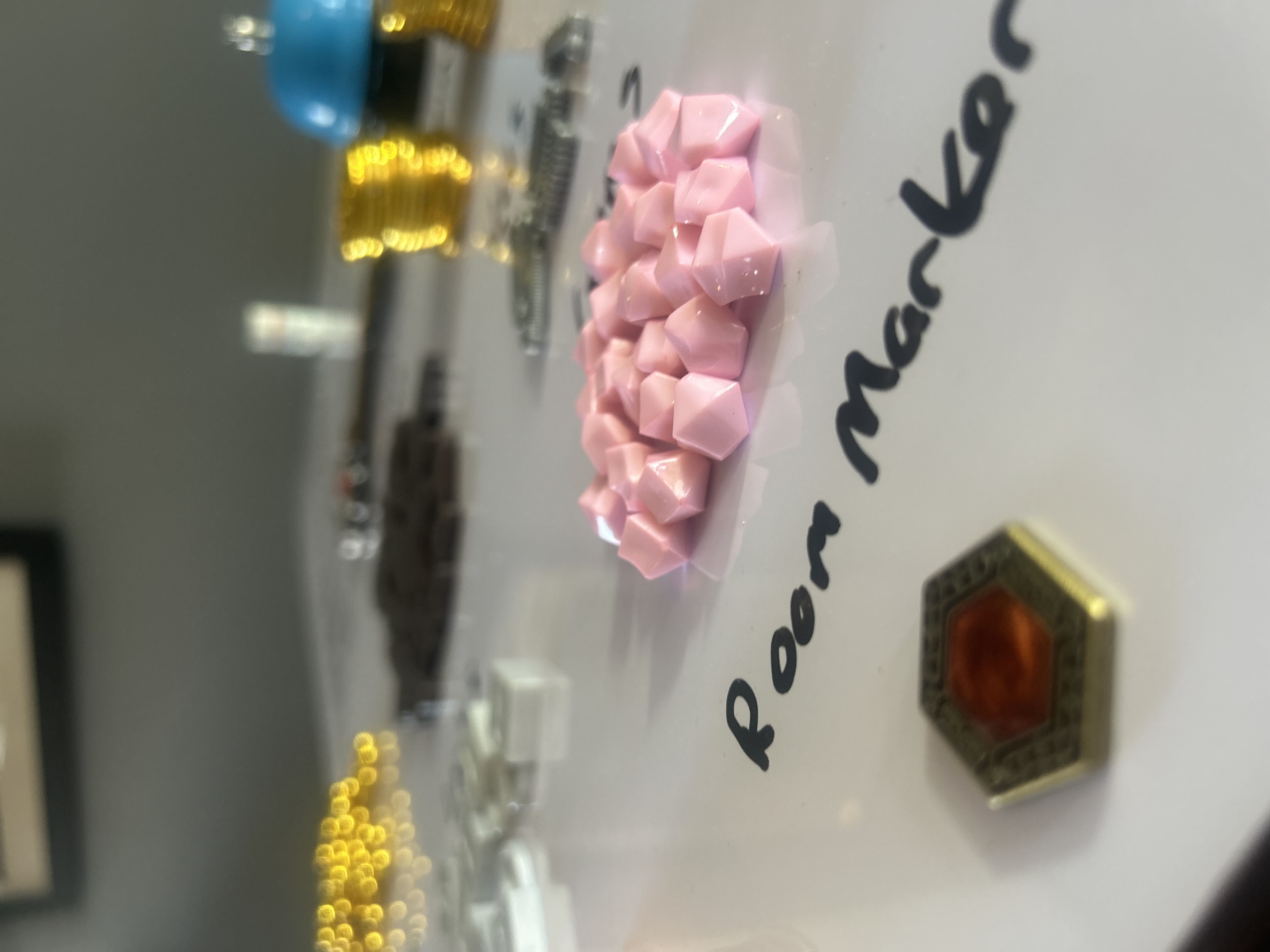 Close-up of gems and room marker